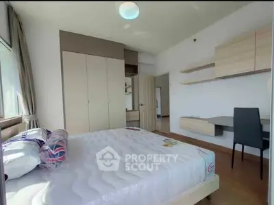 Bright and airy bedroom with modern furnishings and ample natural light