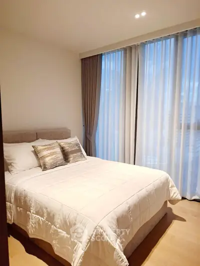 Cozy modern bedroom with elegant curtains and soft lighting