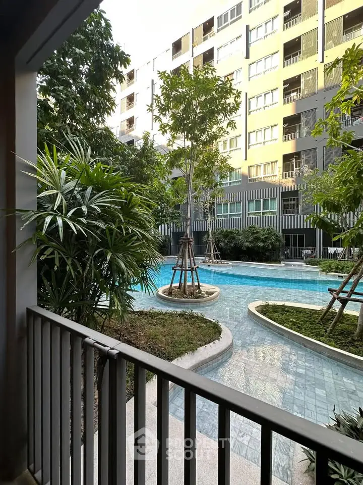 Modern apartment view with lush garden and poolside tranquility