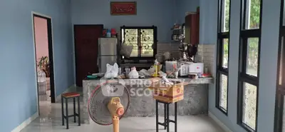 Spacious kitchen with modern appliances and large windows for natural light