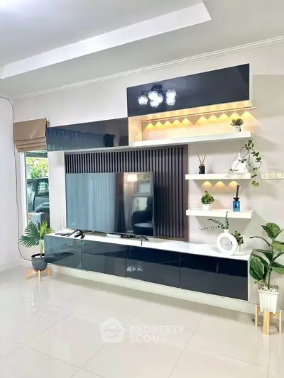 Modern living room with sleek entertainment unit and stylish decor