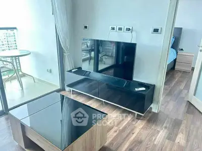 Modern living room with sleek TV unit and balcony view