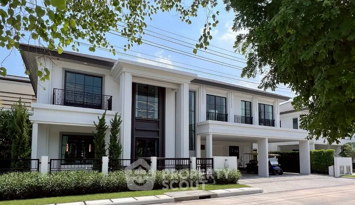 Luxurious modern mansion with elegant facade and lush greenery