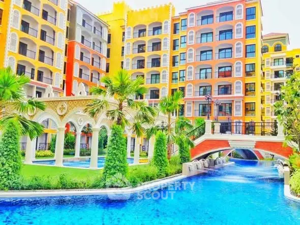 Luxurious resort-style apartment complex with vibrant architecture and stunning pool area.