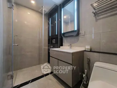 Modern bathroom with sleek design and glass shower enclosure