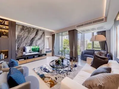 Luxurious modern living room with stylish decor and large windows offering a stunning view.