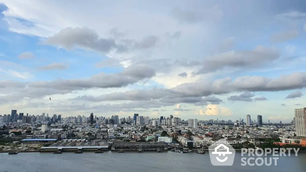 Stunning cityscape view with river and skyline, perfect for urban living enthusiasts.