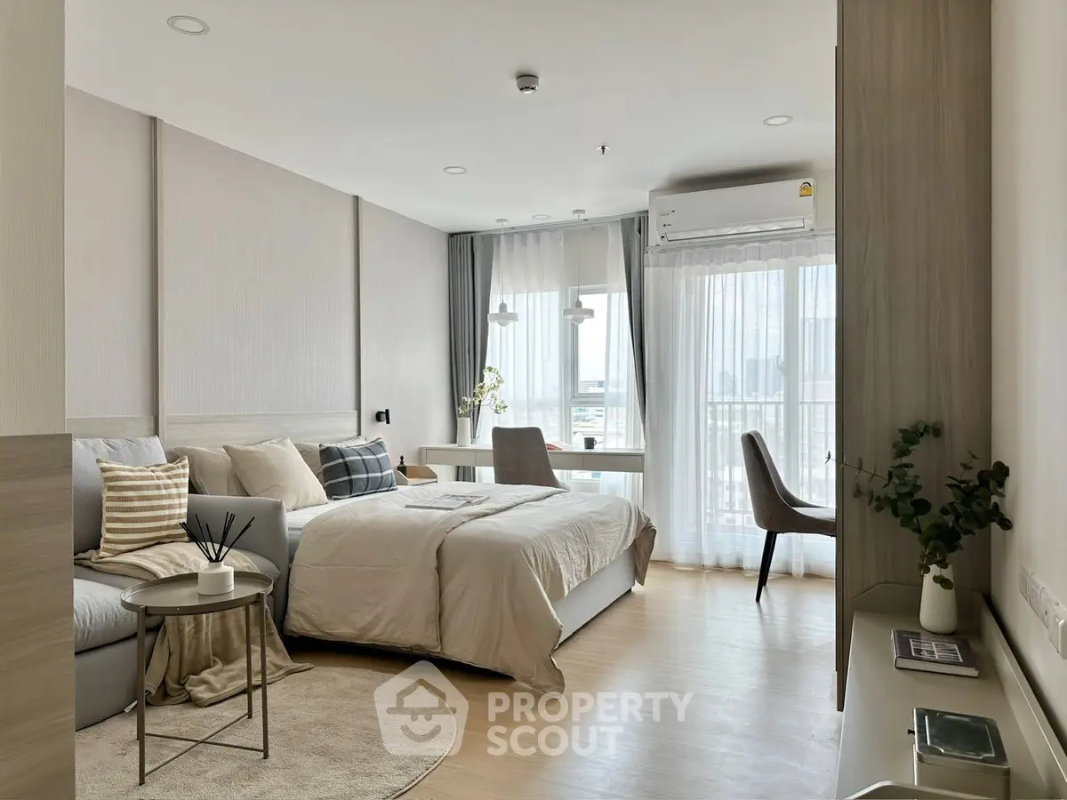 Modern studio apartment with cozy bed and stylish decor