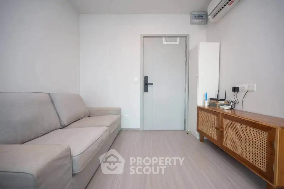 Modern minimalist living room with sleek furniture and neutral tones