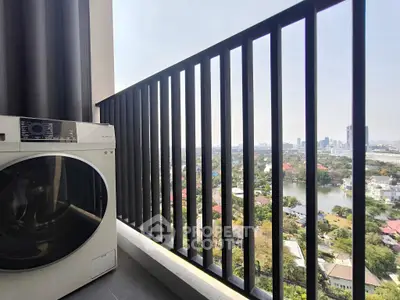 High-rise balcony with city view and washing machine, perfect for urban living.