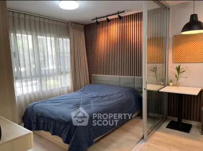 Modern bedroom with stylish wood paneling and natural light