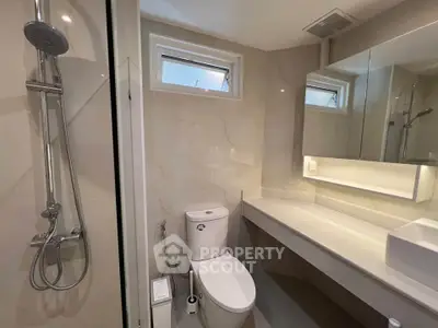 Modern bathroom with sleek fixtures and elegant lighting