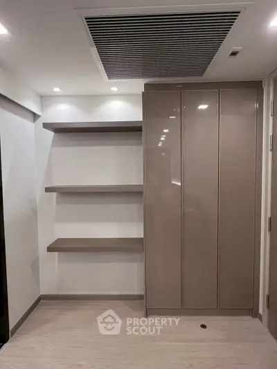 Modern storage space with sleek shelves and cabinets in a minimalist design