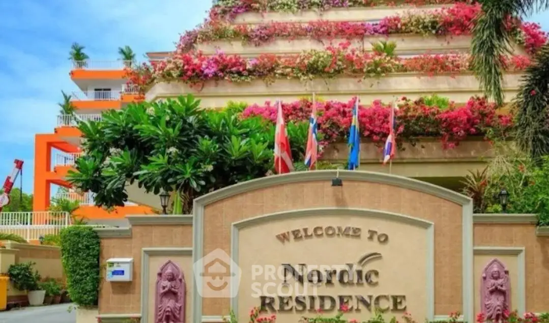 Stunning Nordic Residence with lush greenery and vibrant flowers on a unique pyramid-shaped building.