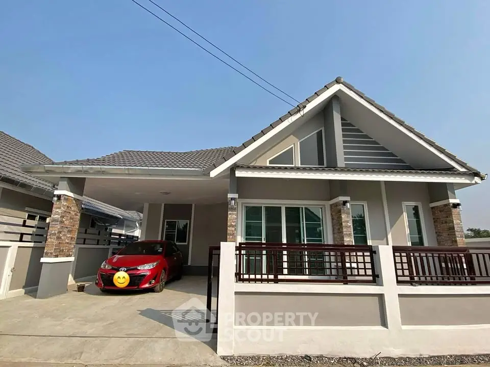 Charming single-story house with modern design and spacious driveway