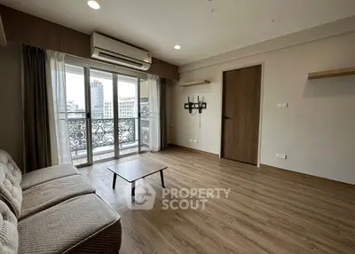 Spacious living room with balcony view in modern apartment