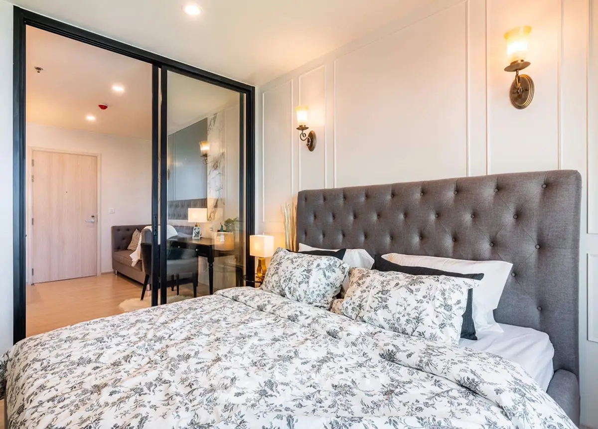 Luxurious bedroom with elegant decor and plush bedding in modern apartment