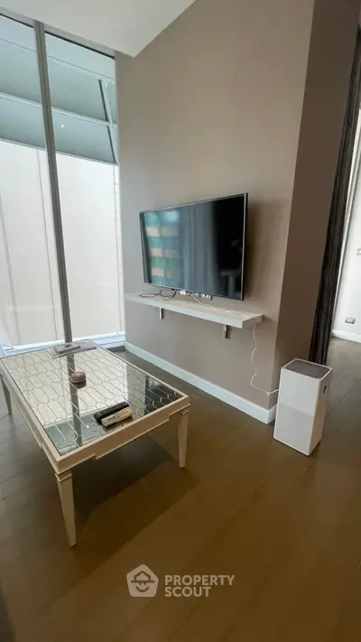 Modern living room with wall-mounted TV and stylish coffee table