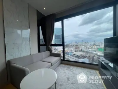 Modern living room with panoramic city view and stylish gray sofa