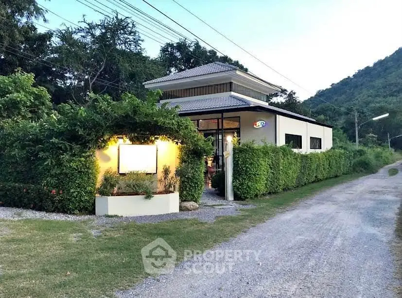 Charming countryside house with lush greenery and modern design