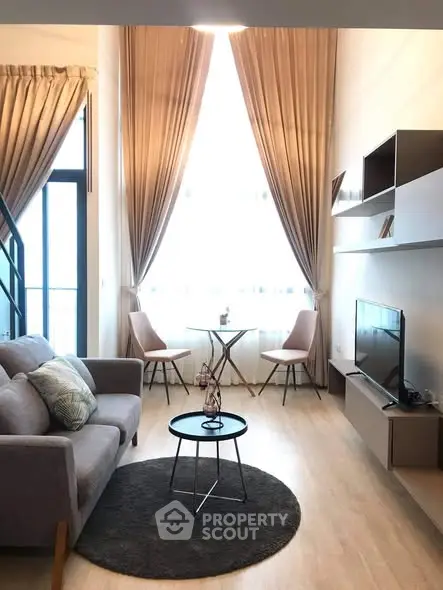 Modern living room with high ceilings and elegant decor