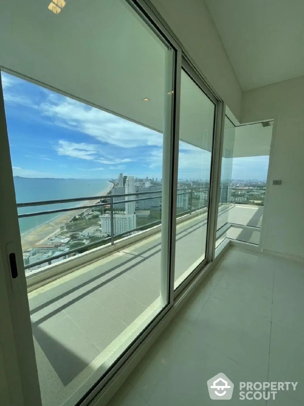 Stunning high-rise apartment with panoramic ocean view and spacious balcony.