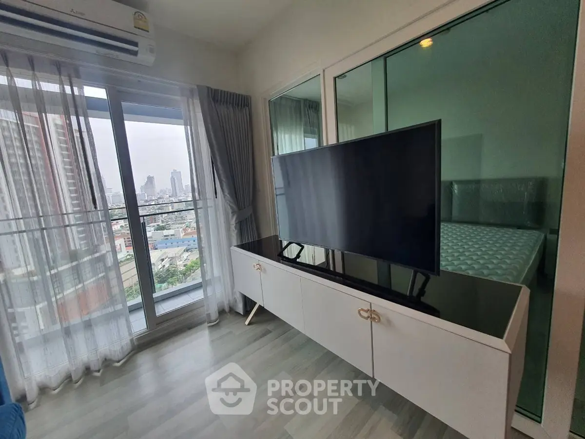 Modern living room with city view and sleek TV setup