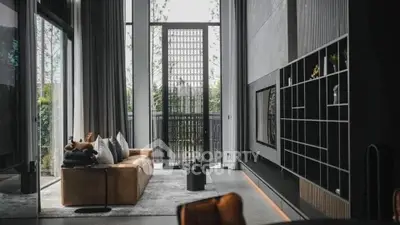 Luxurious modern living room with high ceilings and elegant decor