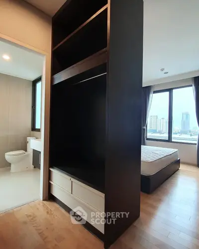 Modern apartment with bedroom, bathroom, and city view