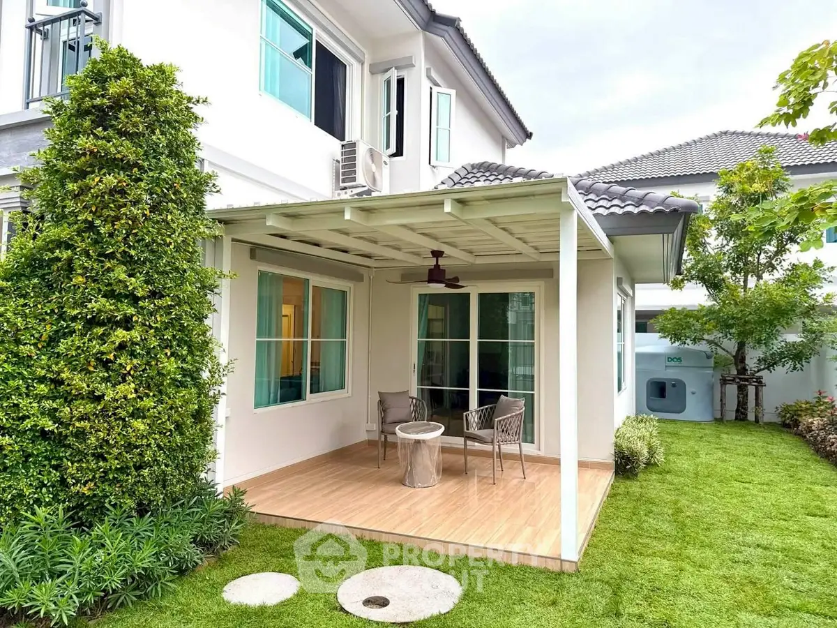 Charming suburban home with cozy patio and lush garden, perfect for outdoor relaxation and entertaining.