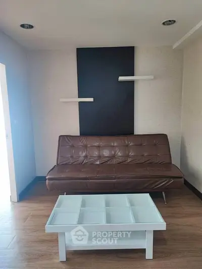 Modern living room with stylish brown sofa and white coffee table