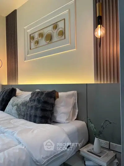 Luxurious bedroom with elegant decor and plush bedding, perfect for relaxation and comfort.