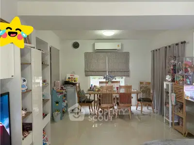 Spacious dining area with modern decor and ample natural light, perfect for family gatherings.
