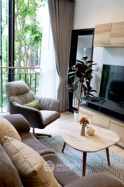 Modern living room with stylish furniture and large window view