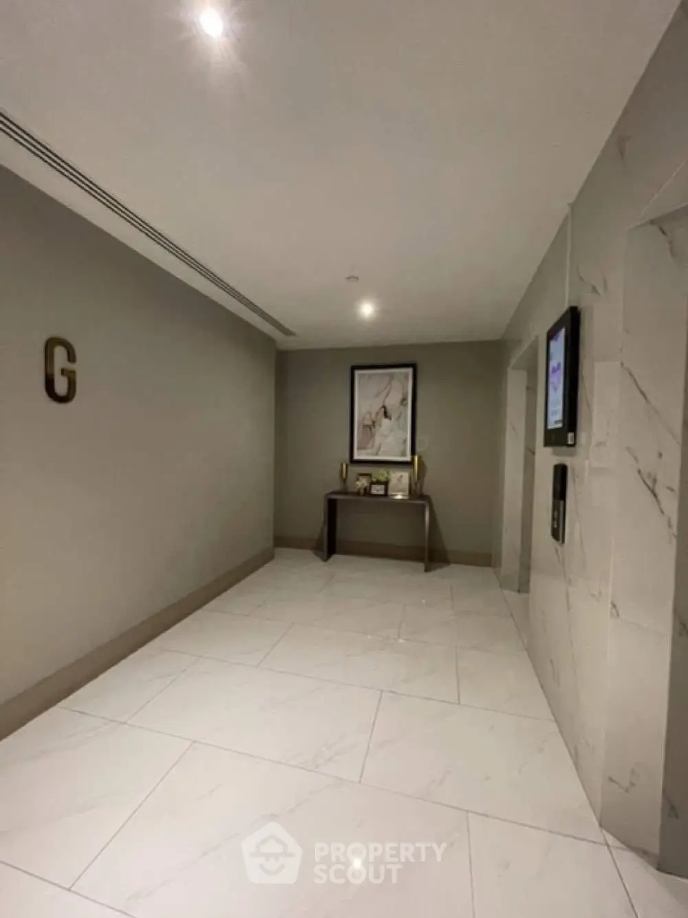 Elegant building corridor with modern decor and polished marble flooring
