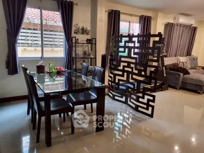 Modern living room with stylish dining area and decorative partition