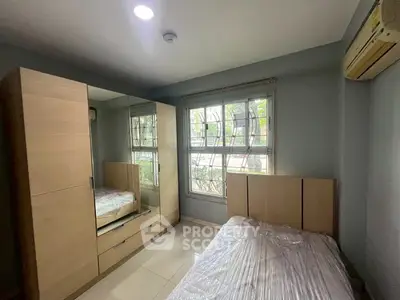 Cozy bedroom with large wardrobe and natural light