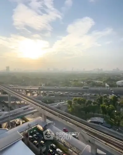 Stunning cityscape view with sunrise over urban skyline and transportation network