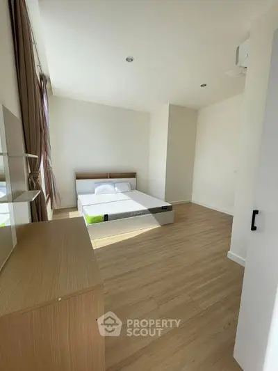 Spacious bedroom with modern design and natural light
