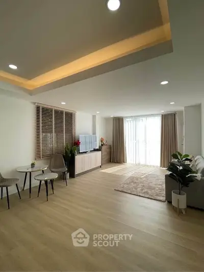 Spacious modern living room with elegant decor and natural light