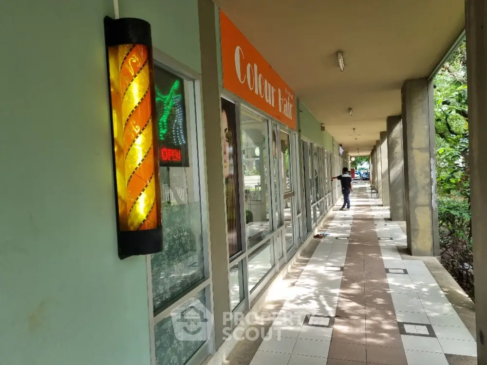 Commercial property exterior with barber shop and vibrant signage