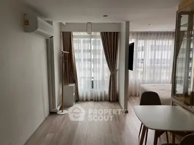 Modern studio apartment with natural light and minimalist decor