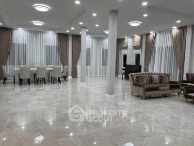 Spacious luxury living room with elegant furniture and large windows