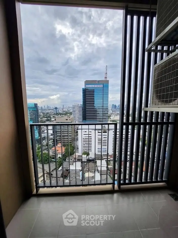 Stunning city view from a modern balcony in a high-rise building.
