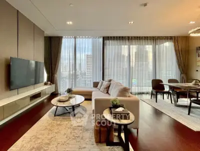 Luxurious modern living room with floor-to-ceiling windows and elegant decor in a high-rise apartment.