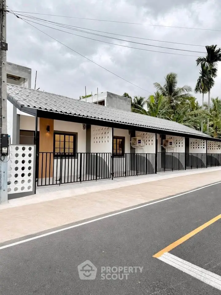 Charming modern bungalow with sleek design and lush surroundings, perfect for serene living.