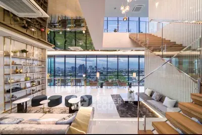 Luxurious modern living room with stunning city view and elegant staircase