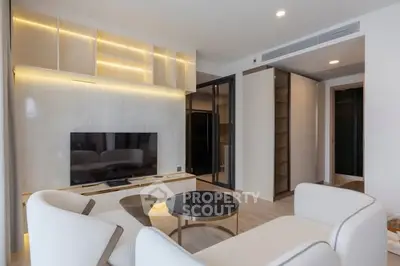 Modern living room with sleek furniture and built-in TV unit