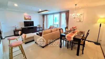 Spacious living and dining area with elegant decor and city view.