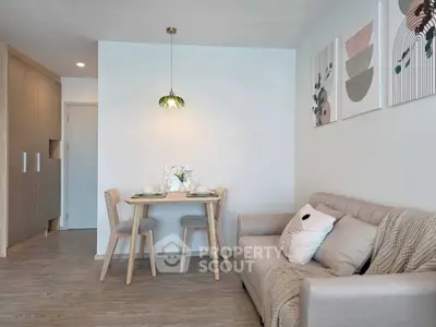 Modern living room with cozy sofa and dining area, featuring stylish decor and ambient lighting.
